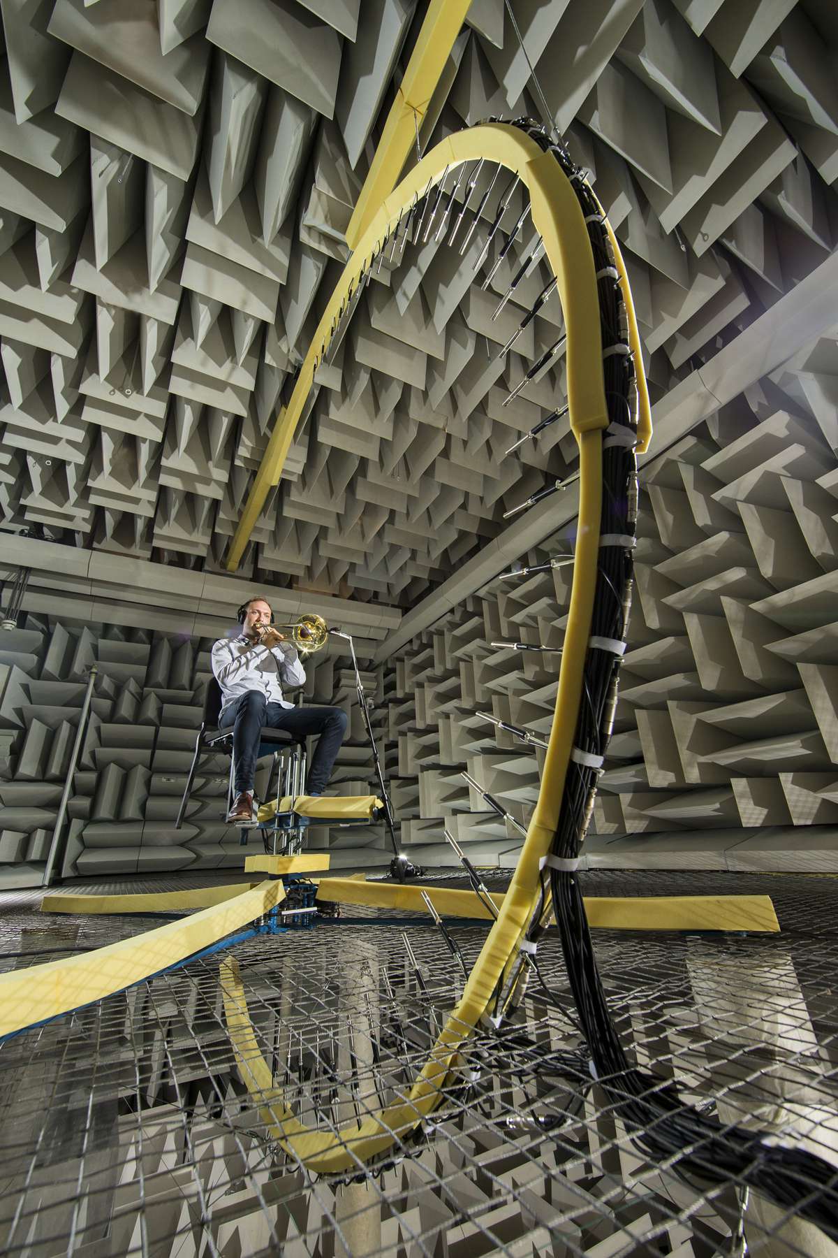 Student playing trombone in the BYU anechoic chamber